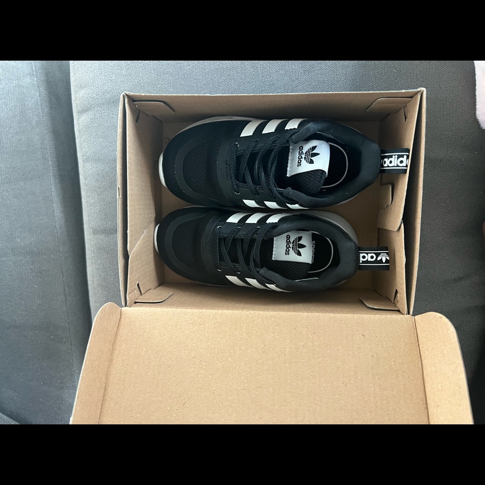Black and white adidas shoes